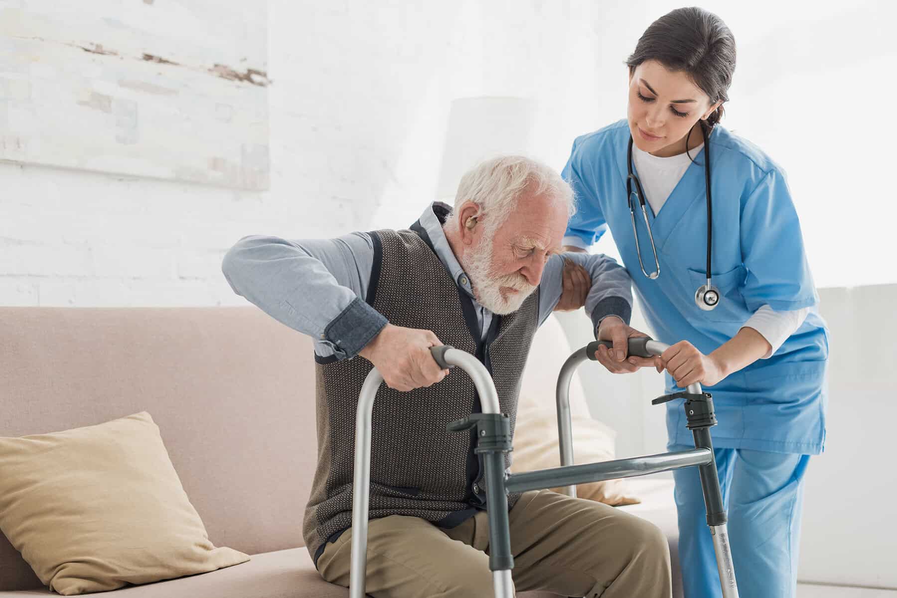 Compassionate home health care services for elderly patients, featuring professional nursing support and assistance with mobility and daily activities in a comfortable home setting.